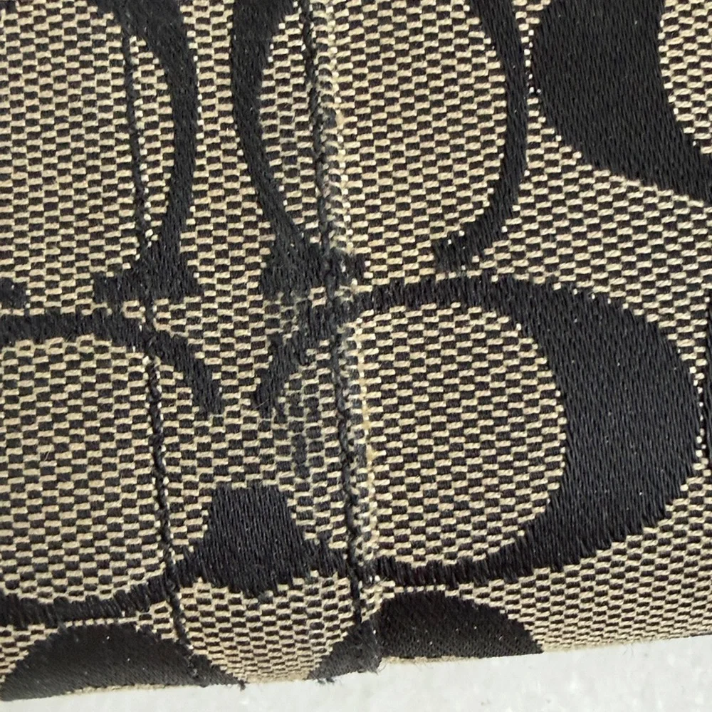 Coach Legacy Signature C jacquard and leather wallet.